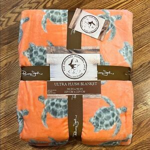 Panama Jack Plush Blanket in Orange with Turtle Design